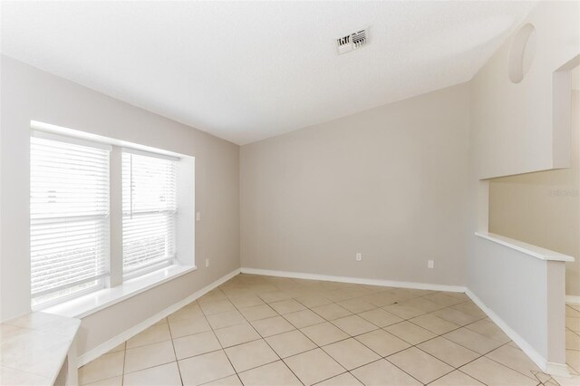 view of tiled spare room