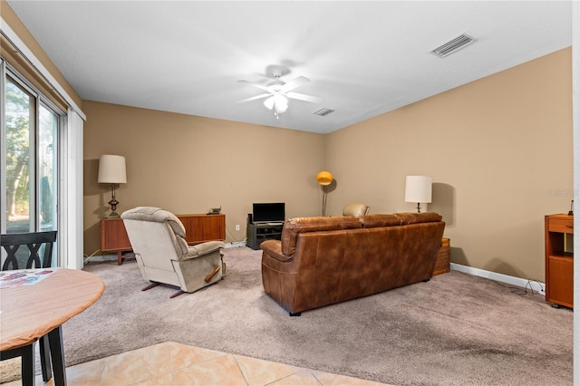 living room with light carpet and ceiling fan