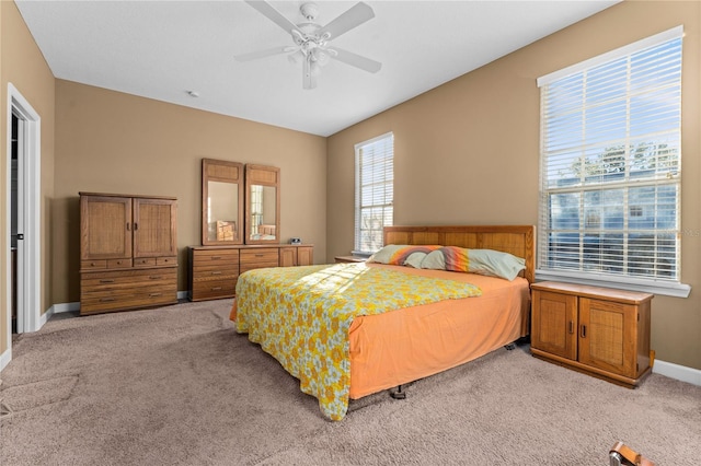 bedroom featuring ceiling fan and light colored carpet