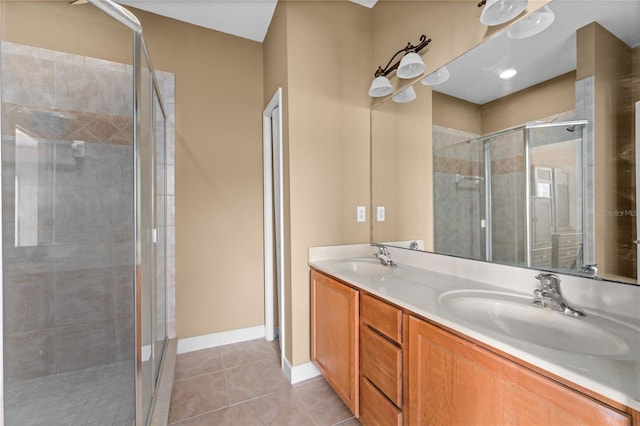 bathroom featuring vanity, tile patterned floors, and an enclosed shower