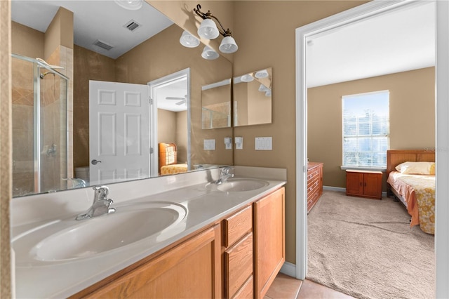 bathroom with tile patterned flooring, vanity, toilet, and walk in shower