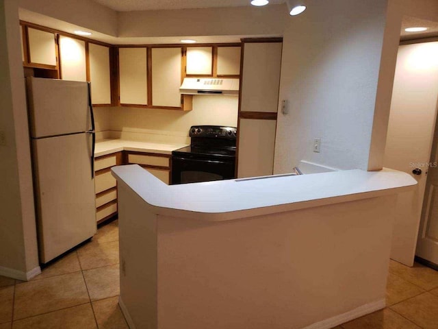 kitchen with kitchen peninsula, white refrigerator, electric range, and light tile patterned flooring