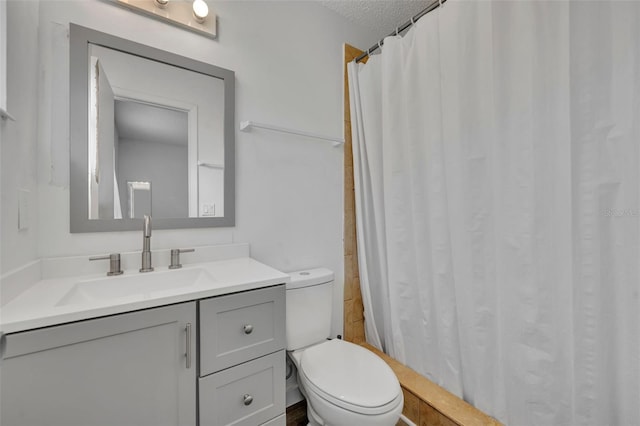 bathroom with vanity, a shower with shower curtain, a textured ceiling, and toilet