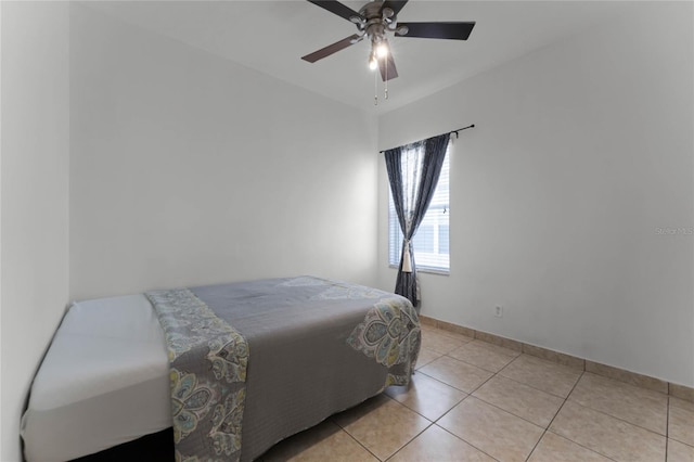 bedroom with light tile patterned floors and ceiling fan