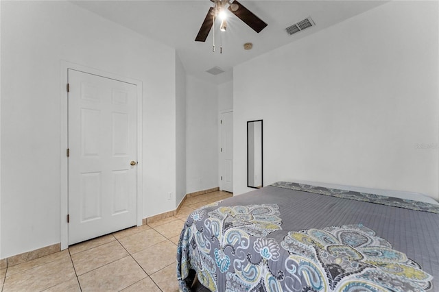 bedroom featuring light tile patterned floors and ceiling fan