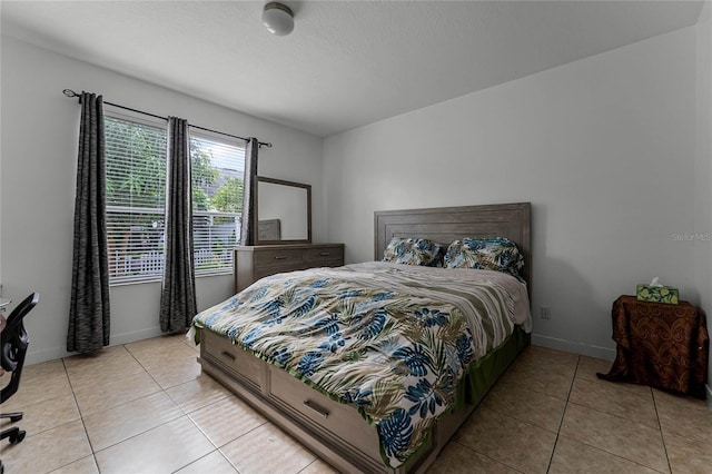 bedroom featuring light tile patterned flooring