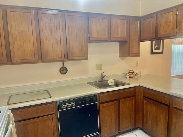 kitchen with kitchen peninsula, sink, light tile patterned floors, range, and black dishwasher