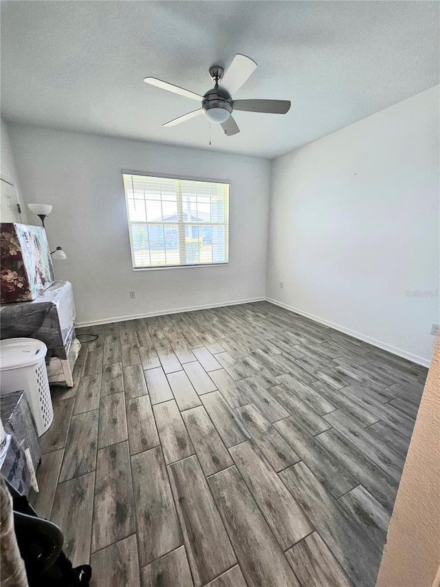 unfurnished living room featuring ceiling fan