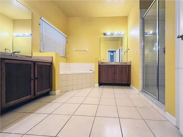 bathroom with vanity, tile patterned floors, and separate shower and tub