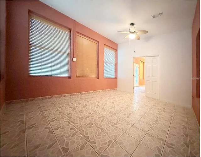 spare room with ceiling fan