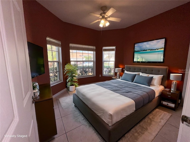 tiled bedroom with ceiling fan