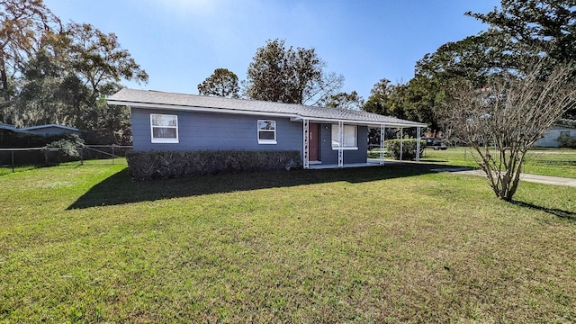 single story home with a front yard