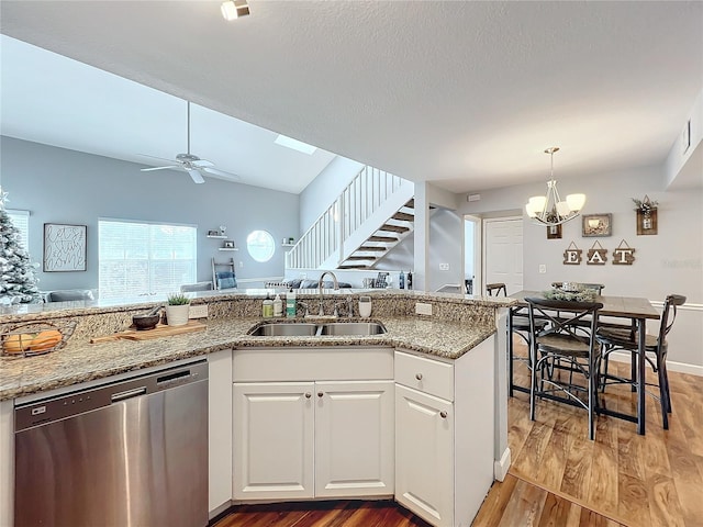 5269 Wellington Park Cir Unit 23, Orlando, FL 32839 - kitchen with stainless steel dishwasher, light wood-type flooring, a ceiling fan, and light stone counters