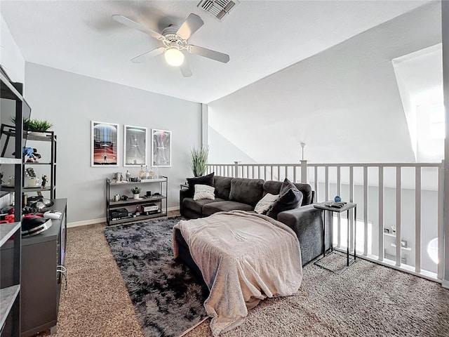 living room with ceiling fan, carpet, and lofted ceiling