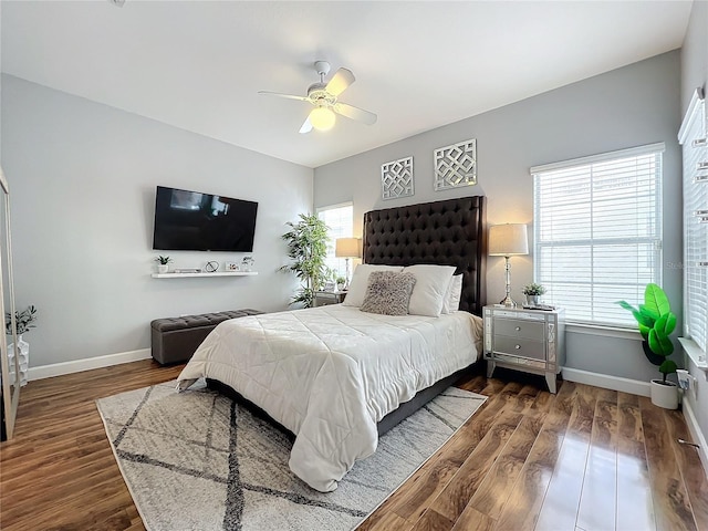 bedroom featuring ceiling fan and dark wood-type flooring