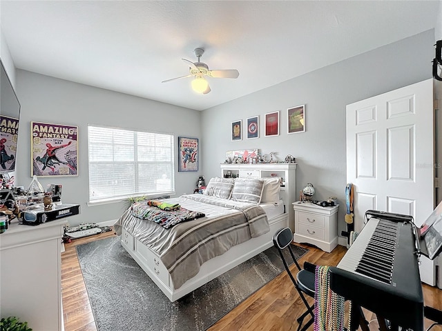 bedroom with wood-type flooring and ceiling fan