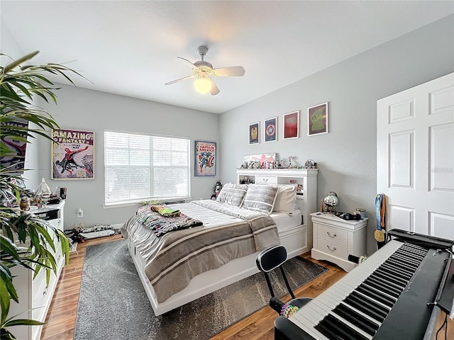 bedroom featuring light wood-type flooring and ceiling fan