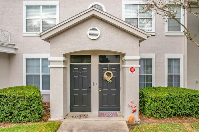 5269 Wellington Park Cir Unit 23, Orlando, FL 32839 - doorway to property featuring stucco siding