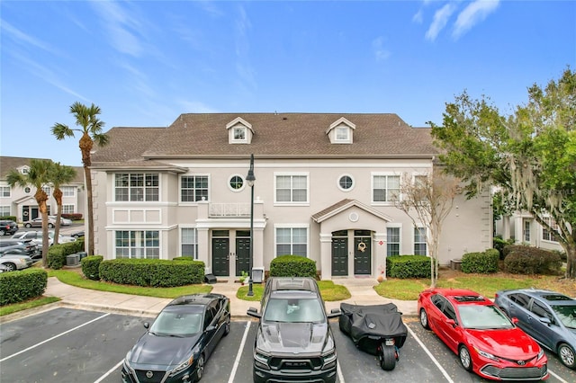 5269 Wellington Park Cir Unit 23, Orlando, FL 32839 - view of building exterior with uncovered parking