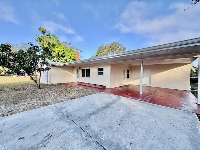 exterior space featuring a carport