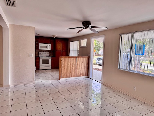 kitchen featuring white appliances, ceiling fan, and light tile patterned flooring