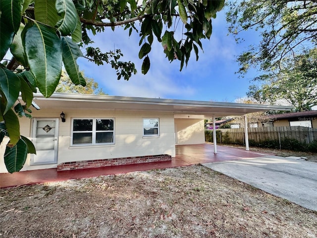 view of home's exterior with a carport