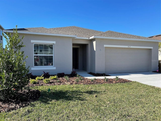 ranch-style house with driveway, a front yard, an attached garage, and stucco siding