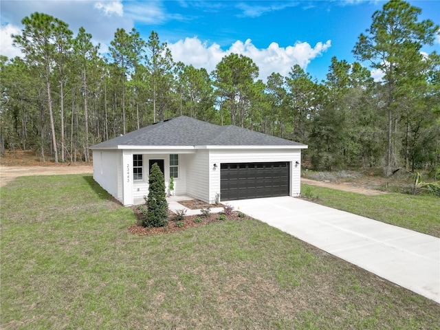 view of front of home with a front lawn, covered porch, and a garage