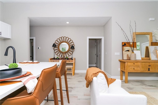 dining space with light wood-type flooring