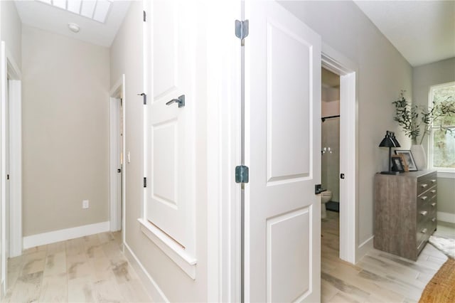 hallway with light wood-type flooring