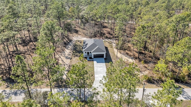 drone / aerial view with a view of trees