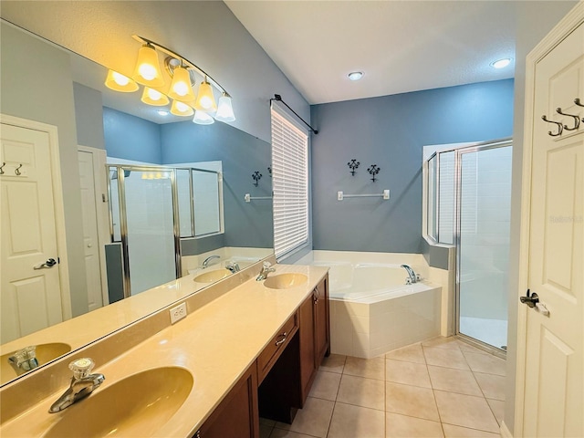 bathroom featuring tile patterned floors, vanity, and independent shower and bath