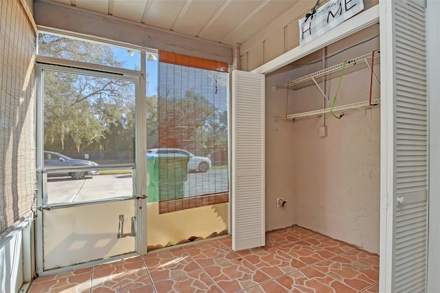 unfurnished sunroom with plenty of natural light