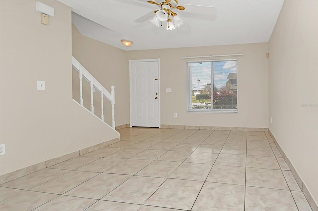 entrance foyer featuring ceiling fan and light tile patterned flooring