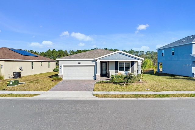 view of front of house with a garage and a front yard