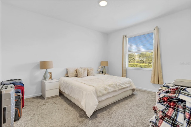 bedroom featuring light colored carpet