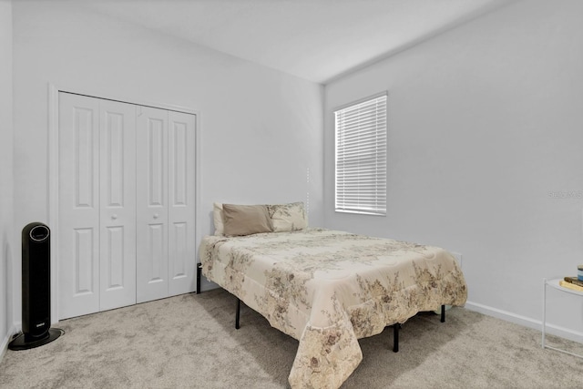 carpeted bedroom with a closet