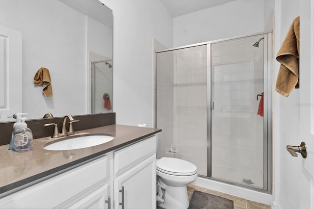 bathroom with vanity, an enclosed shower, tile patterned flooring, and toilet