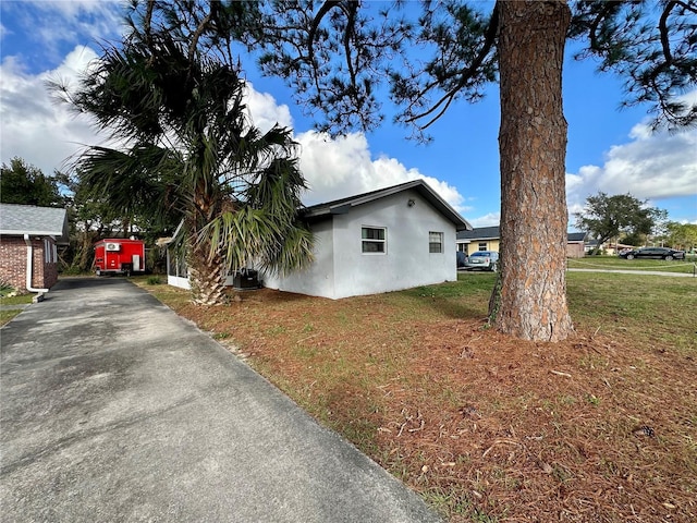 view of home's exterior featuring a lawn