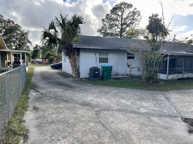 view of side of property featuring cooling unit