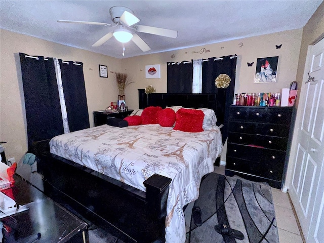 bedroom with light tile patterned floors and ceiling fan