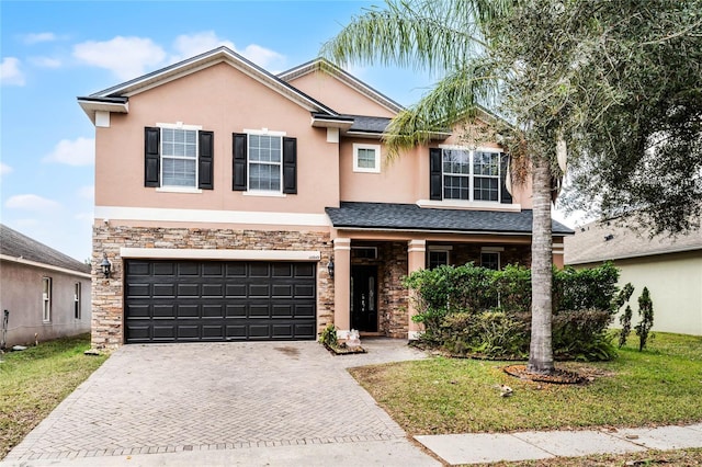 view of front facade featuring a front yard and a garage