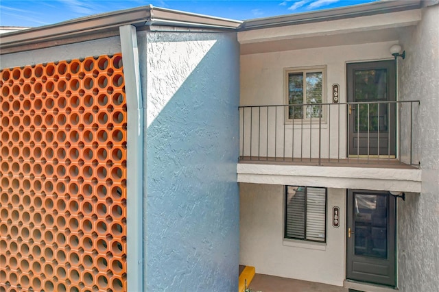 property entrance with a balcony