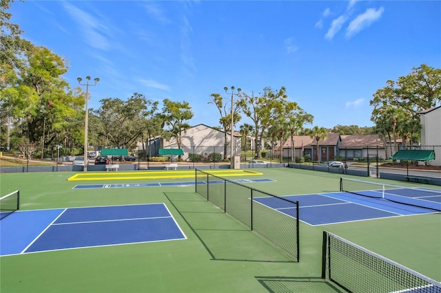 view of sport court featuring basketball hoop