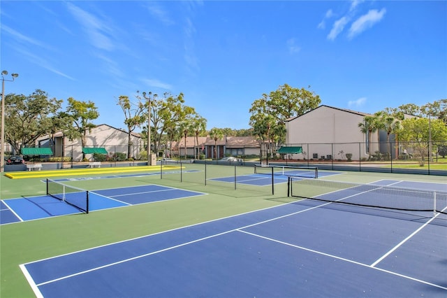 view of tennis court featuring basketball court