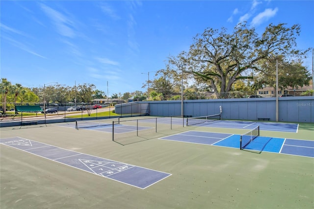 view of tennis court with basketball court