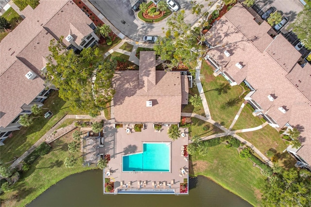 birds eye view of property with a water view