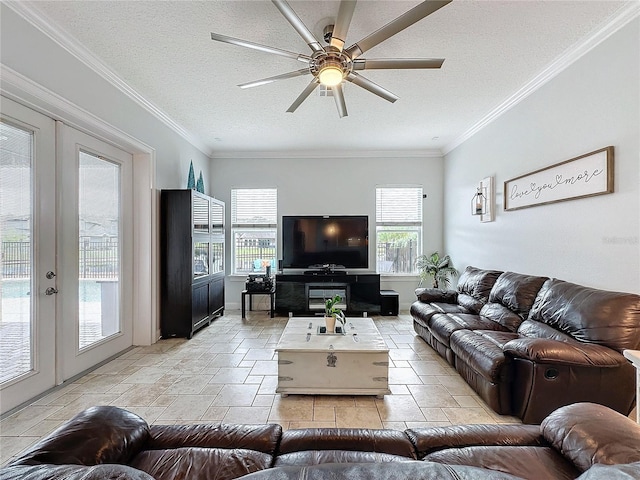 living room with ceiling fan, french doors, a textured ceiling, and ornamental molding