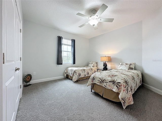 carpeted bedroom with a textured ceiling and ceiling fan