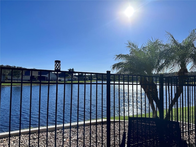 view of swimming pool with a water view